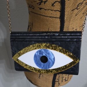 Kurt Geiger Black and Gold Eye Clutch - Used Like New